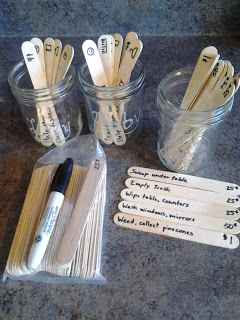 Mason jars with family chores written on popsicle sticks, no chore chart needed.