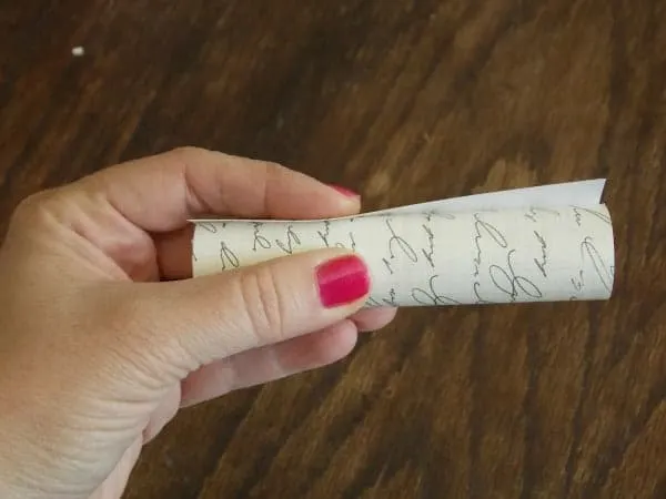 Check the size of paper by rolling it around the candle cover