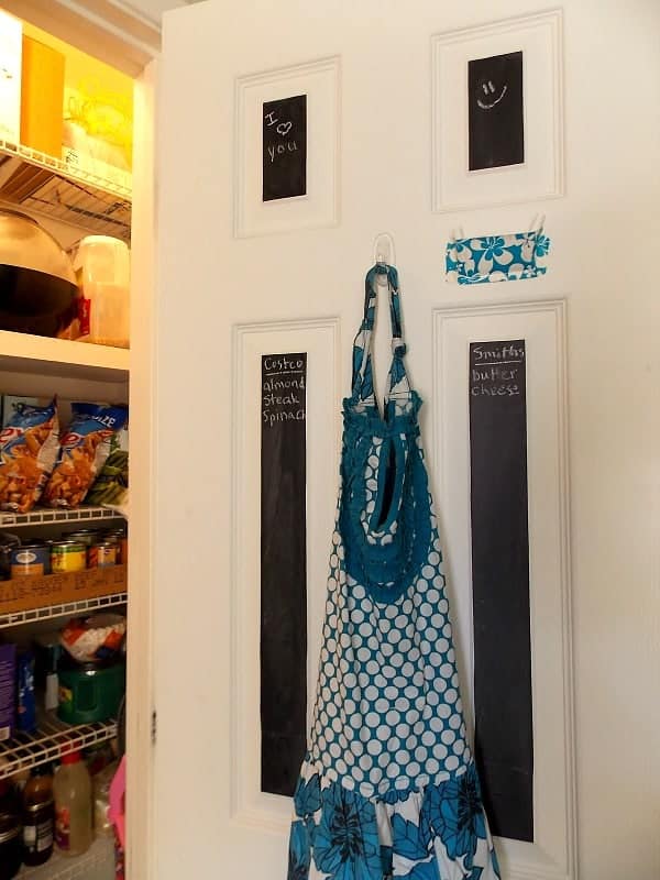Blue floral apron hanging in the pantry