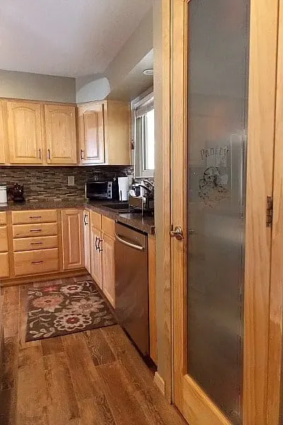 Frosted glass ties in nicely with the stainless steel appliances.