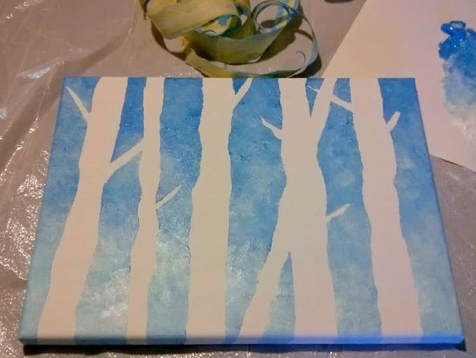 Masking tape trees on a blue canvas