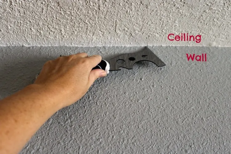 The trick to getting that perfect line when painting between ceiling and wall.