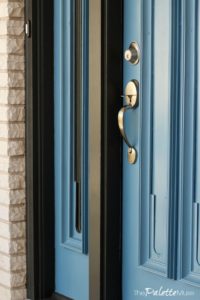 Front door makeover with Curb Appeal paint and fresh hardware.