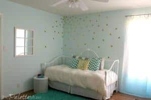 This gold vinyl polka dot wall treatment is easy to do yourself!