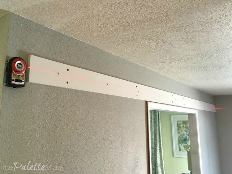 A laser level helping to hand double barn doors