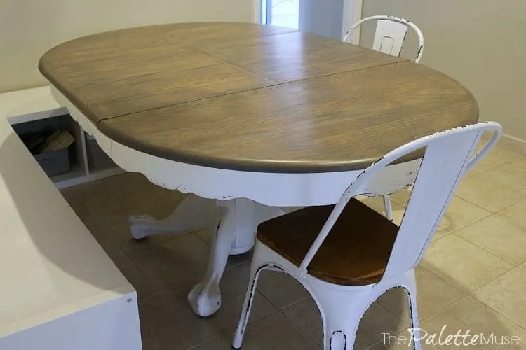 Finished gray and white farmhouse table and matching chairs.