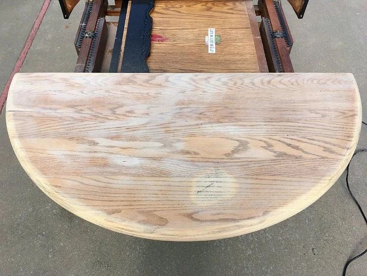 Farmhouse table restoration in progress with sanded table top