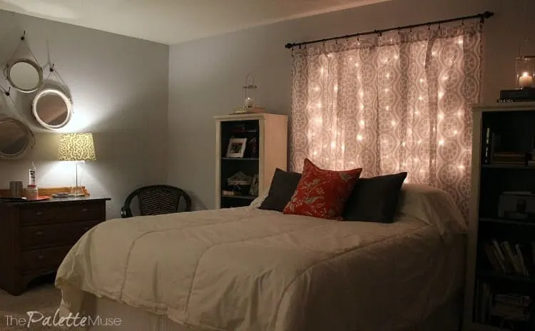 Cozy bedroom with lit headboard and lamps