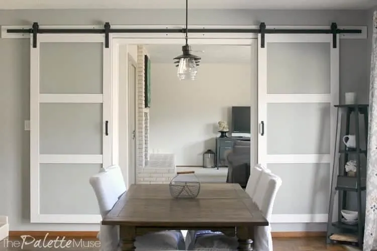White double barn doors in dining room