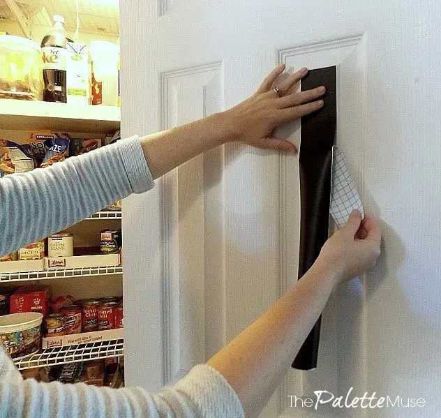 Applying chalkboard paper to the inside of a pantry door for grocery lists.