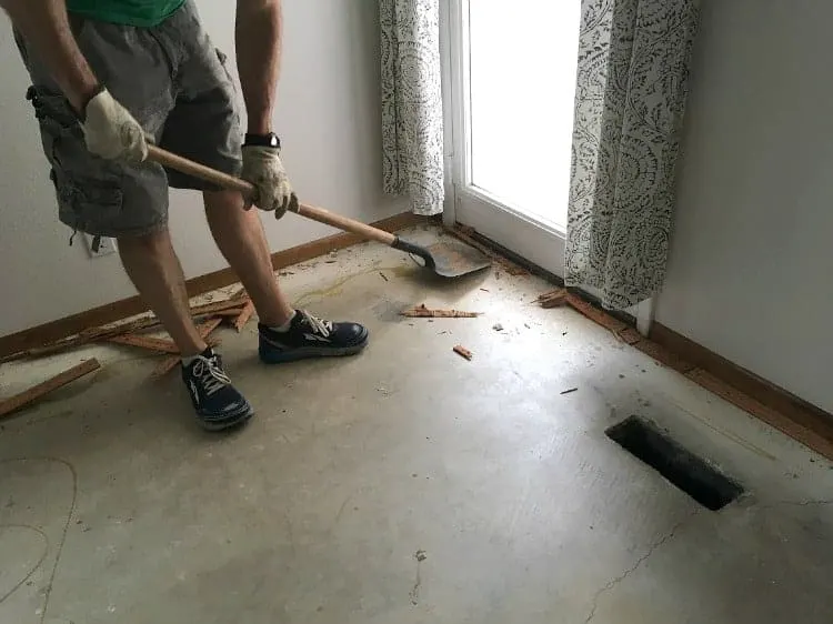 Removing carpet tack strips with a shovel