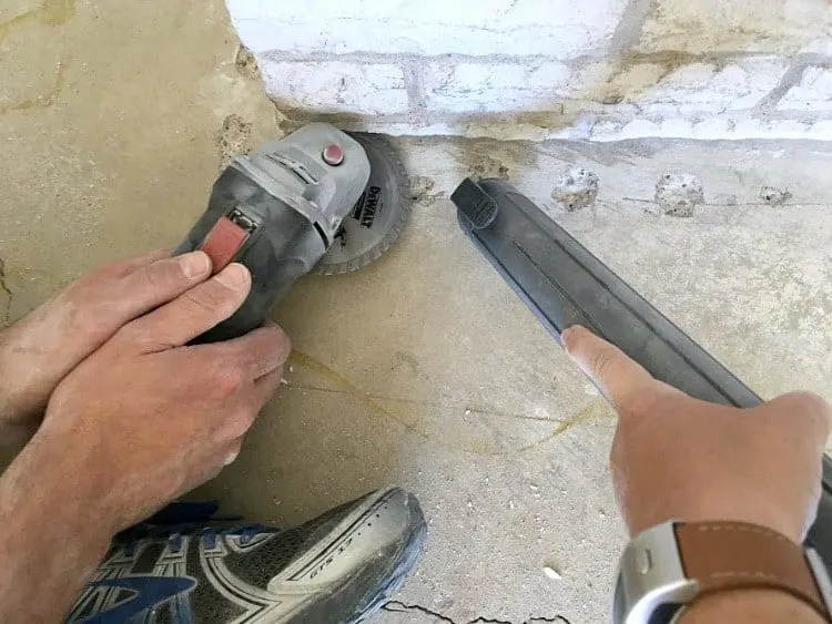Undercutting stone hearth for installing laminate flooring