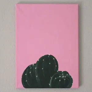 Green cacti painted on a pink background