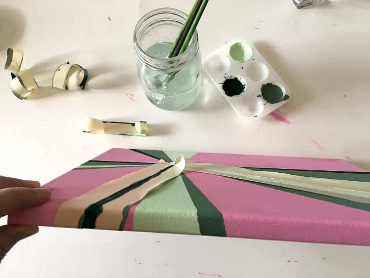 The paint from the front of the canvas wraps around the edges