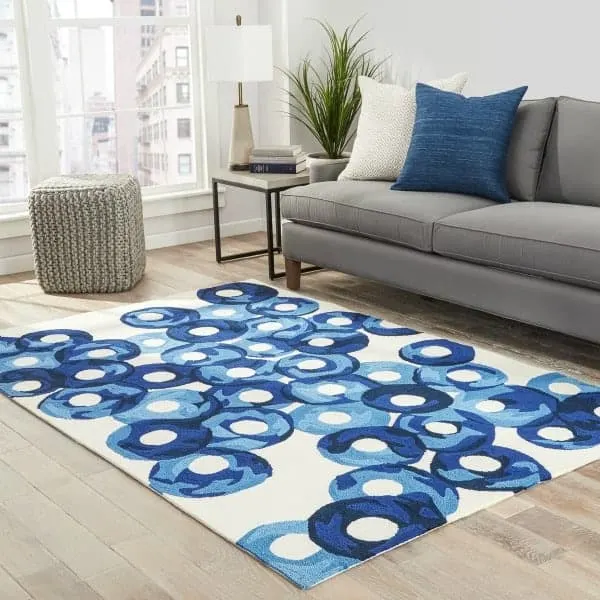 White rug with blue circles