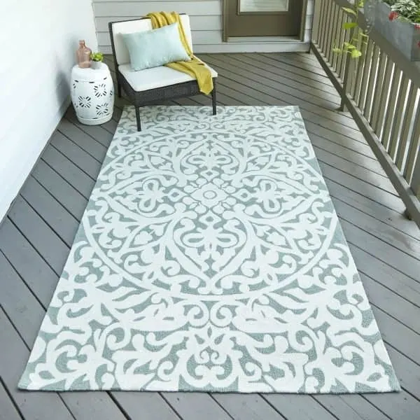Aqua and white patterned outdoor rug