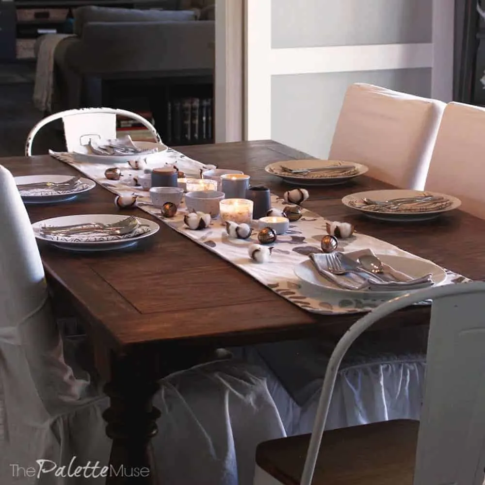 Warm candlelight gives this simple tablescape a cozy feel.