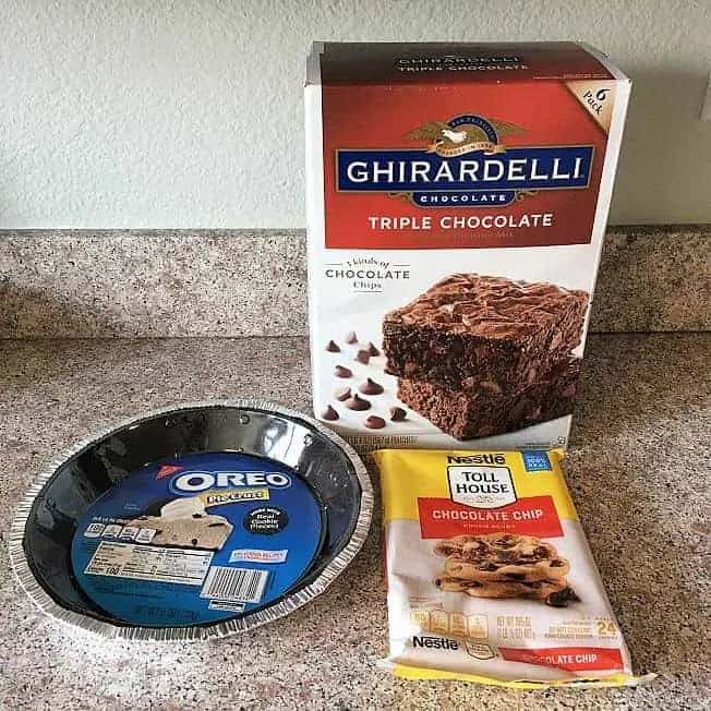 Ingredients for Easy Brownie Pie - Oreo pie crust, Nestle Tollhouse chocolate chip cookie dough, Ghirardelli triple chocolate brownie mix.