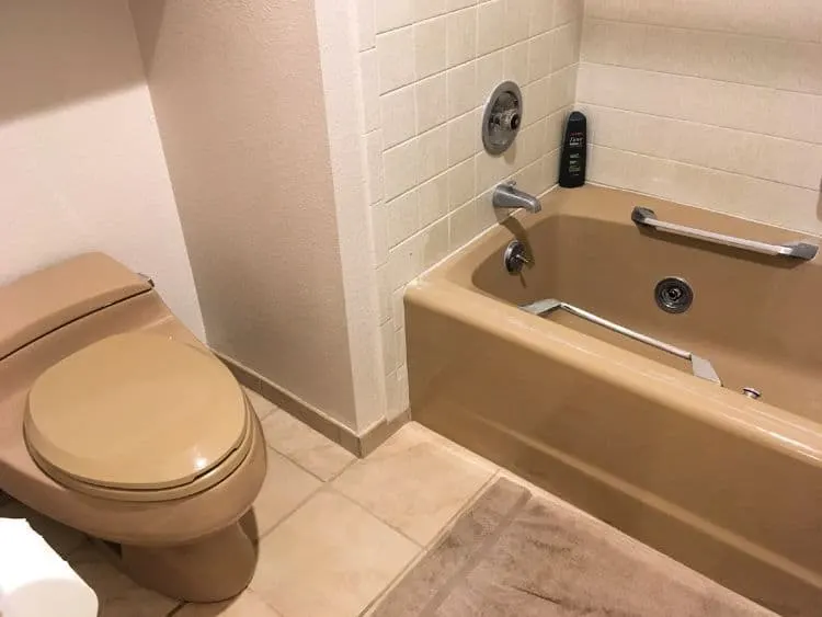 Matching brown toilet and tub.