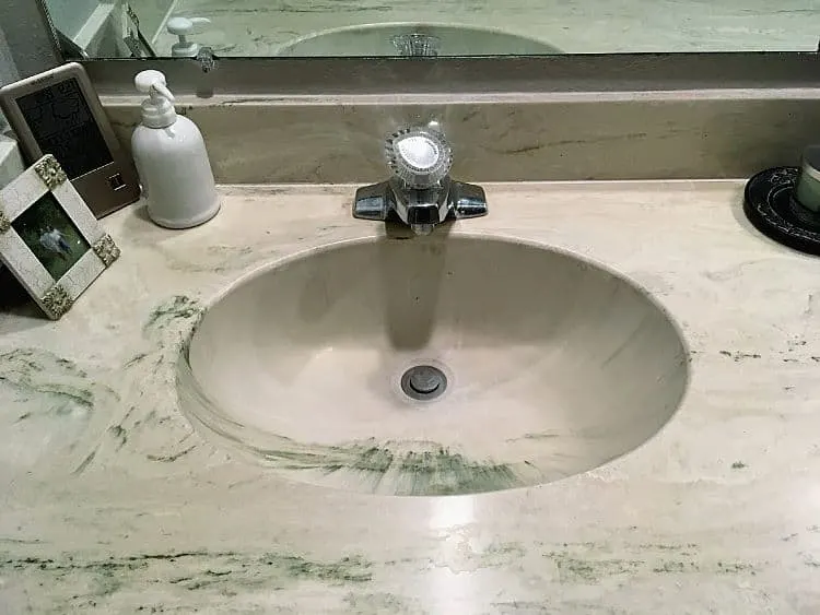 Green cultured marble sink and countertop.