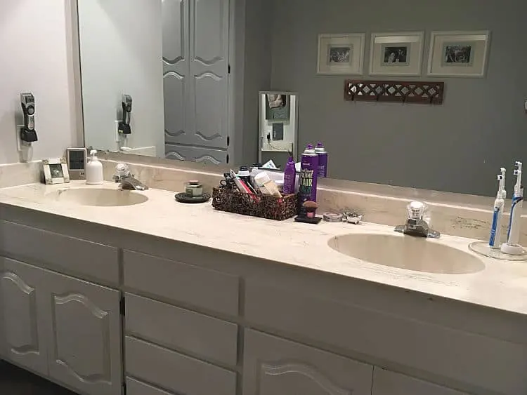 White cabinets help, but this bathroom is still dated and dark.