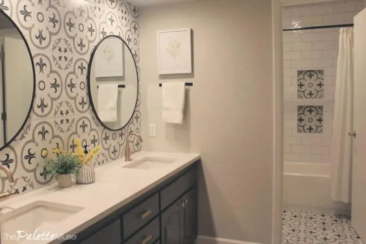 Bright updated bathroom with patterned tile backsplash