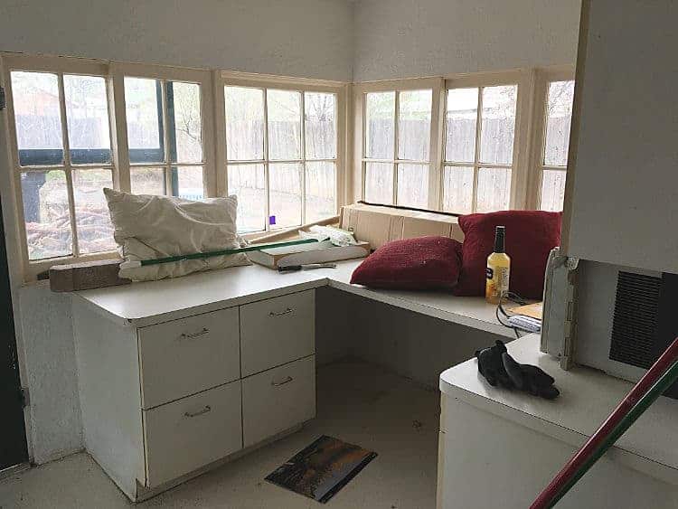 Neglected sunroom with clutter everywhere