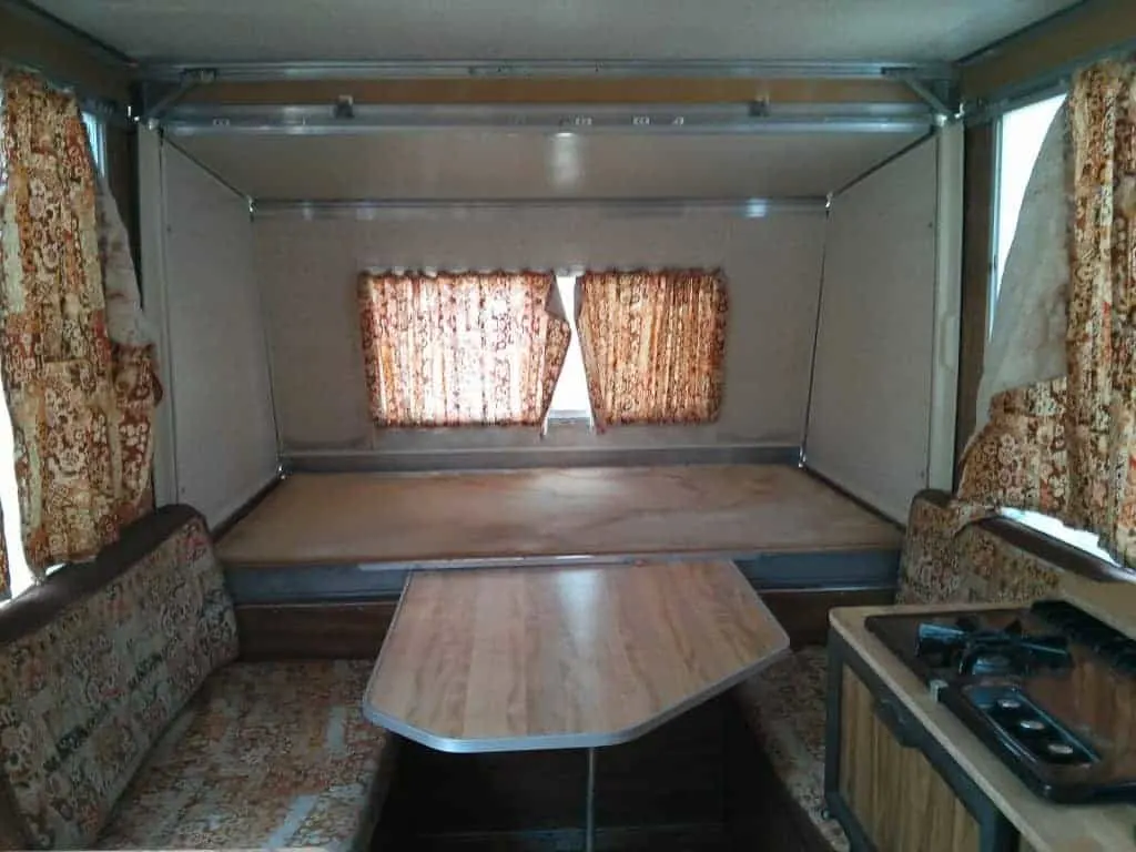 Apache Camper interior with original brown curtains
