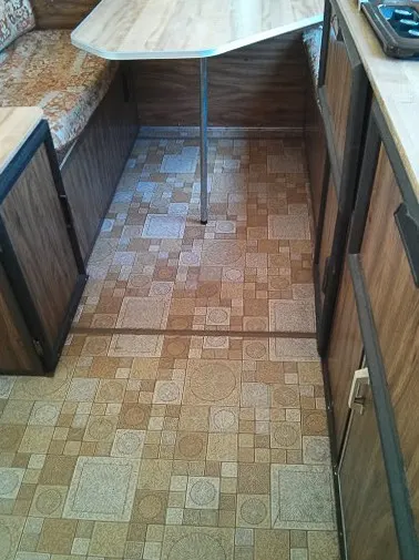 Brown and yellow patterned linoleum flooring in Apache camper