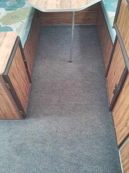 Gray outdoor carpet as flooring in Apache camper