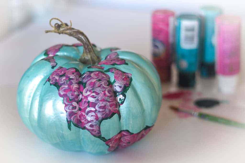Floral painted pumpkin and painting supplies
