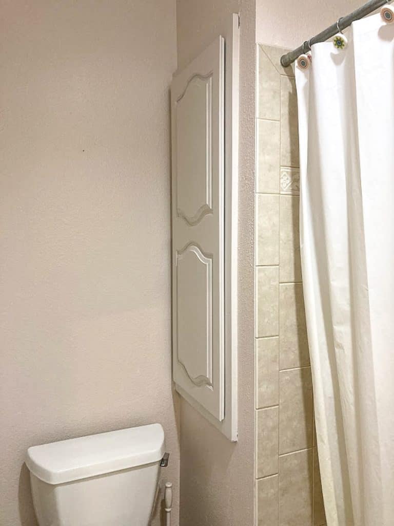 Painted white cabinet in bathroom