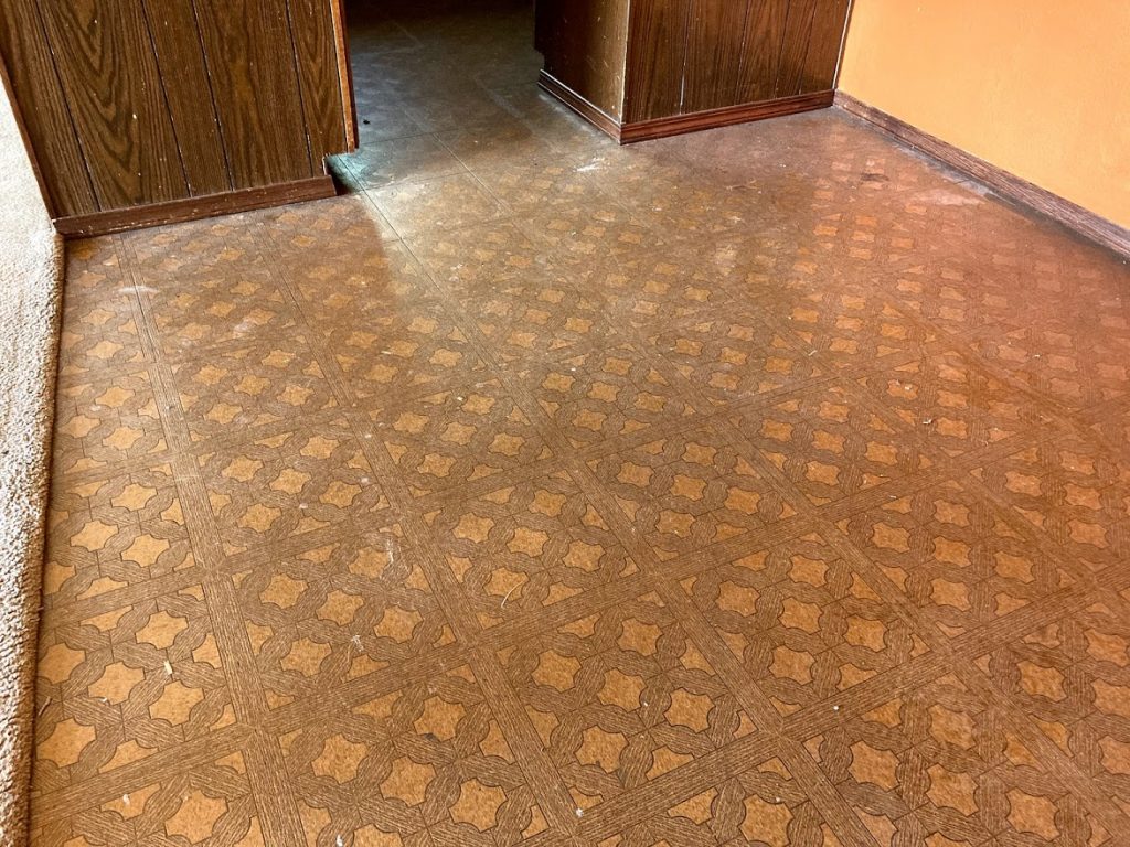 Flip House Before, dated brown linoleum flooring