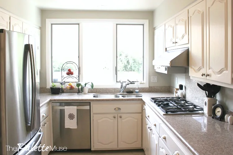 A bright kitchen with white painted cabinets