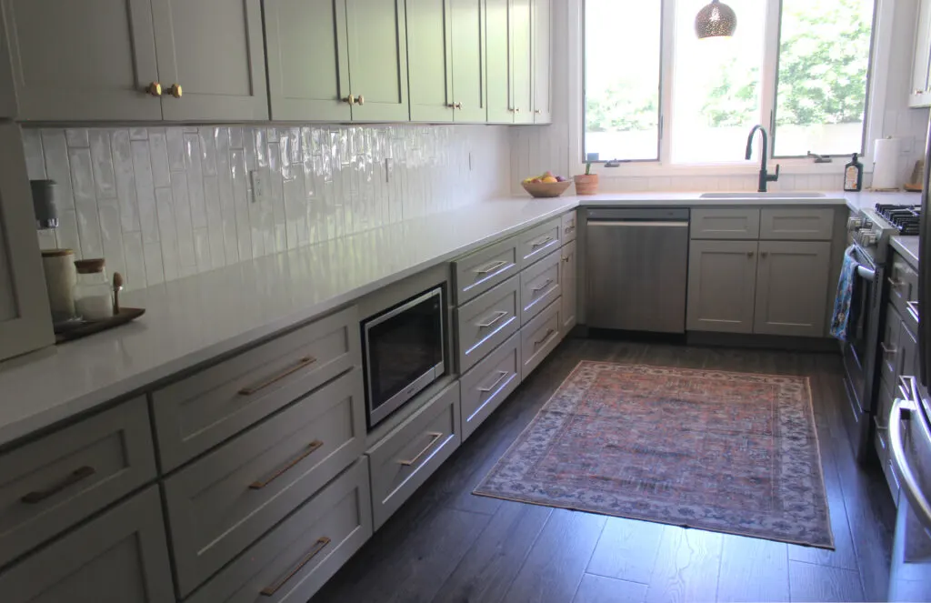 Kitchen Remodel Resources: Long bank of kitchen cabinets with an under-counter microwave