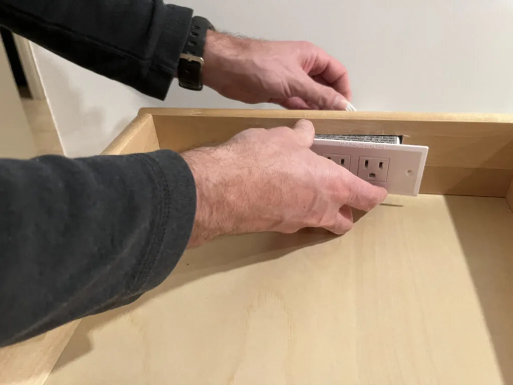 Installing a charging strip in the back of a drawer to turn the drawer into a a charging drawer.
