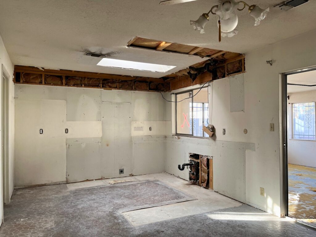 How our flip house looked with the kitchen cabinets ripped out.
