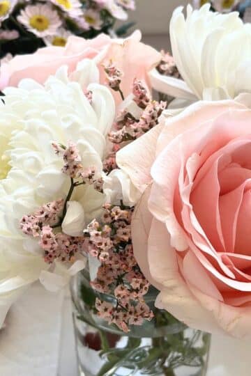 How to fall in love with your home again. Image of close up pink and white flowers.
