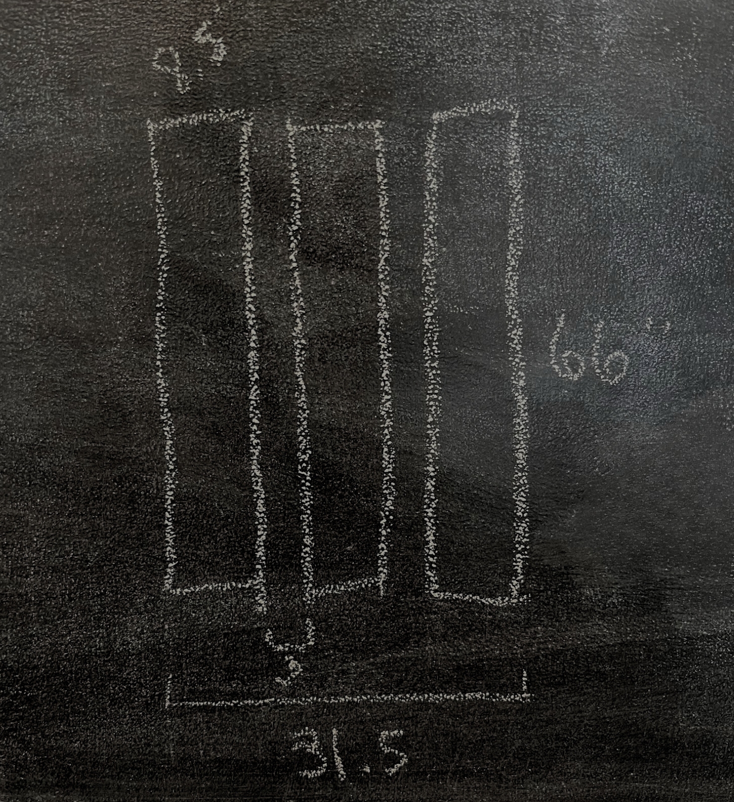 A chalkboard diagram showing measurements for molding pieces.